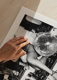 Black and white photograph of two women on party stairs with disco ball-9