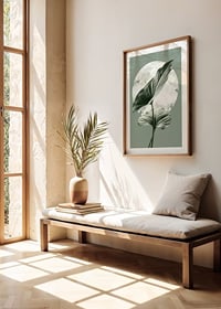 Illustration of green homalomena leaves against light circle shape-8