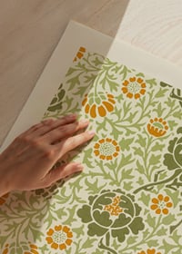 Dense, graphic pattern with winding foliage, orange flowers and green leaves against a dark background-3