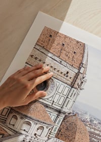 Photograph of Florence Cathedral with terracotta roof and city view-3