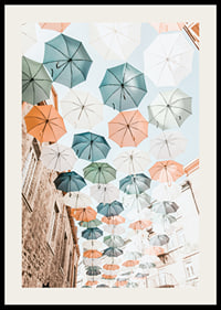 Photograph of colorful umbrellas floating over a city street-2