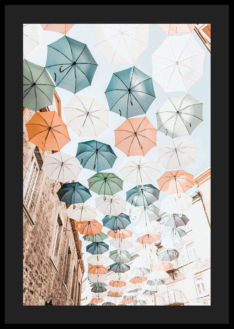 Photograph of colorful umbrellas floating over a city street-12