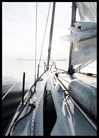 Photograph of sailboat deck with white sails and calm sea-6