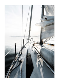 Photograph of sailboat deck with white sails and calm sea-1