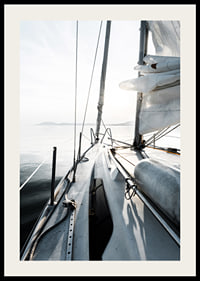 Photograph of sailboat deck with white sails and calm sea-2