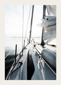 Photograph of sailboat deck with white sails and calm sea-3