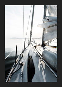 Photograph of sailboat deck with white sails and calm sea-5