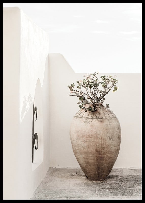 Large clay pot with plant against white plastered wall, photographic-12