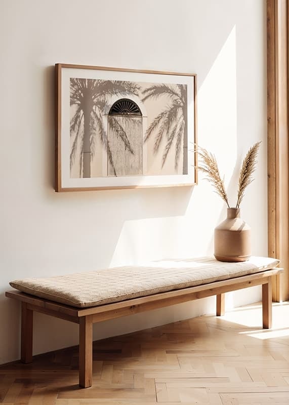 Photograph of wooden door with palm tree shadows on light facade-12