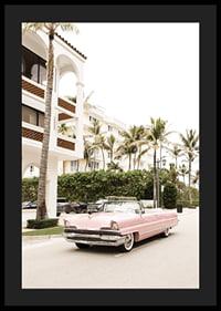 Photographic vintage car in pink in front of palm-lined buildings-4