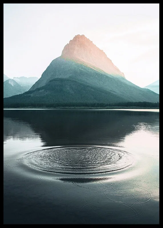 Photograph of water ripples on lake with mountains in the background-12