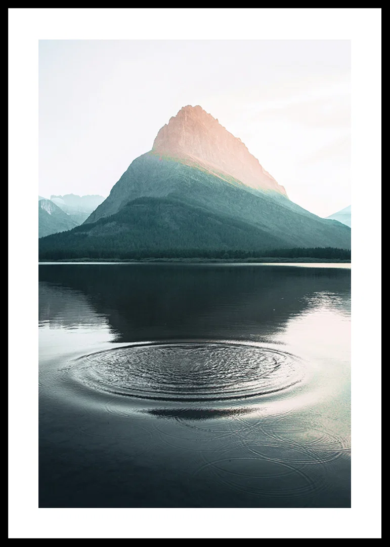 Photograph of water ripples on lake with mountains in the background-12