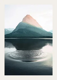 Photograph of water ripples on lake with mountains in the background-3