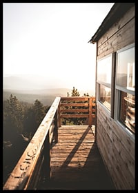 Photograph of wooden porch against sunset and forest in warm tones-6