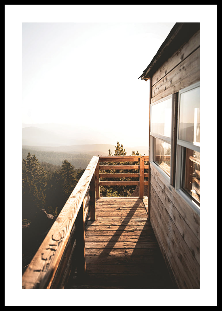 Photograph of wooden porch against sunset and forest in warm tones-12