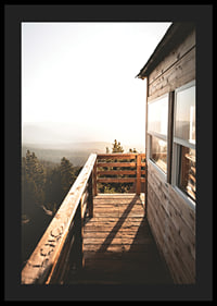 Photograph of wooden porch against sunset and forest in warm tones-4