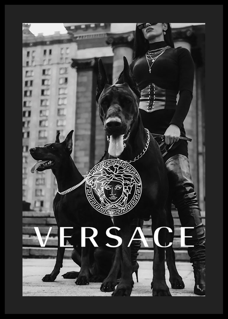 Black and white fashion photo of woman with two Doberman dogs-12