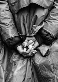 Black and white close-up of hands with cigarette behind back-7