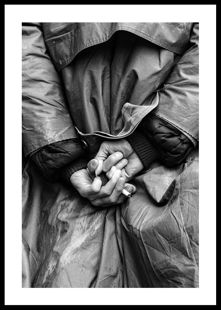 Black and white close-up of hands with cigarette behind back-12