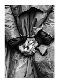 Black and white close-up of hands with cigarette behind back-1