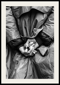 Black and white close-up of hands with cigarette behind back-2