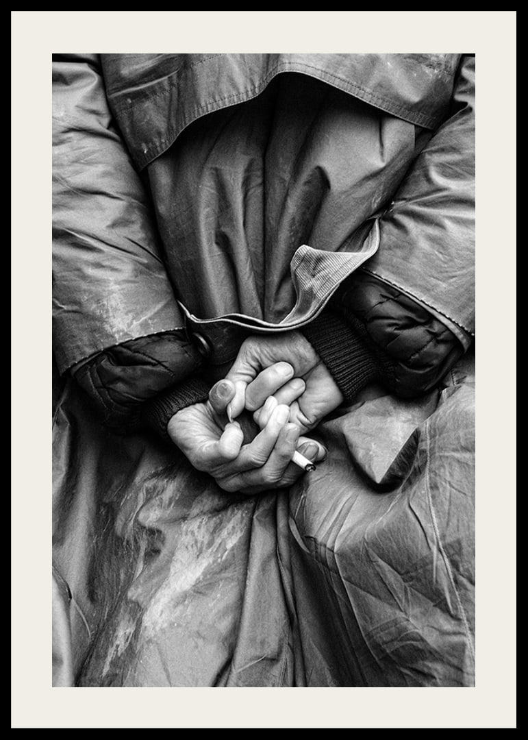 Black and white close-up of hands with cigarette behind back-12