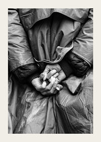 Black and white close-up of hands with cigarette behind back-3