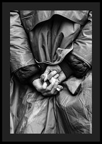 Black and white close-up of hands with cigarette behind back-4