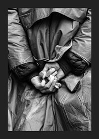 Black and white close-up of hands with cigarette behind back-5