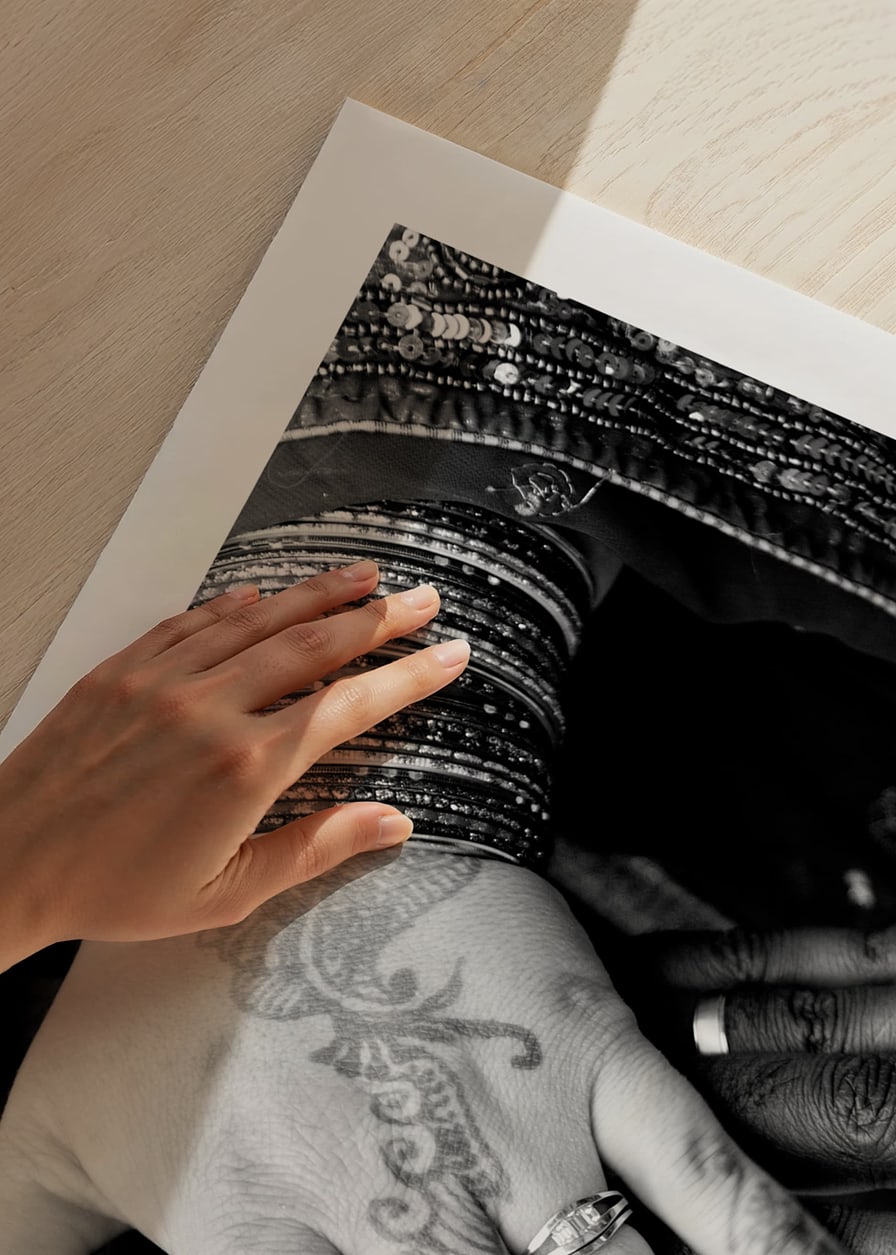 Black and white photo of hands decorated with henna and jewelry-12