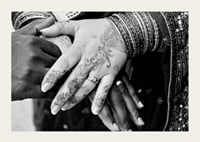 Black and white photo of hands decorated with henna and jewelry-3