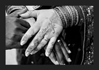 Black and white photo of hands decorated with henna and jewelry-5
