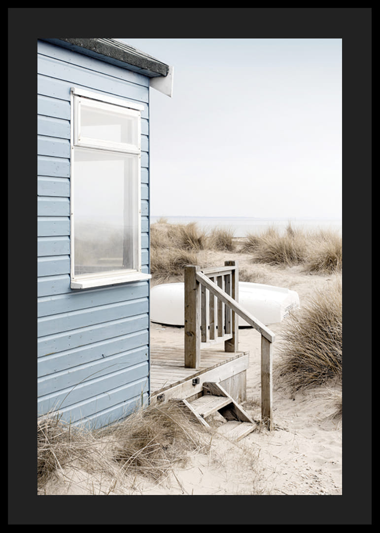Photograph of light blue beach house by sand dunes and dry grass-12