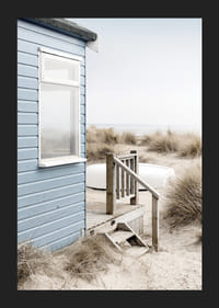 Photograph of light blue beach house by sand dunes and dry grass-5