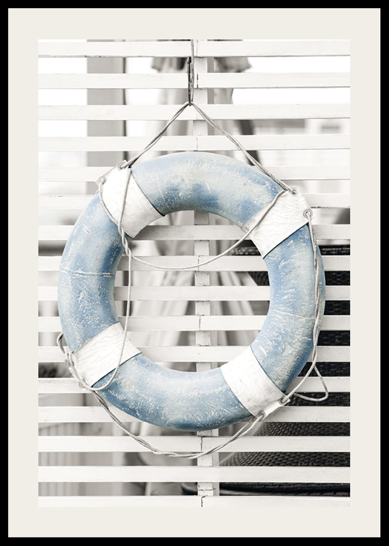 Photograph of light blue lifebuoy against white wooden wall in retro style-12