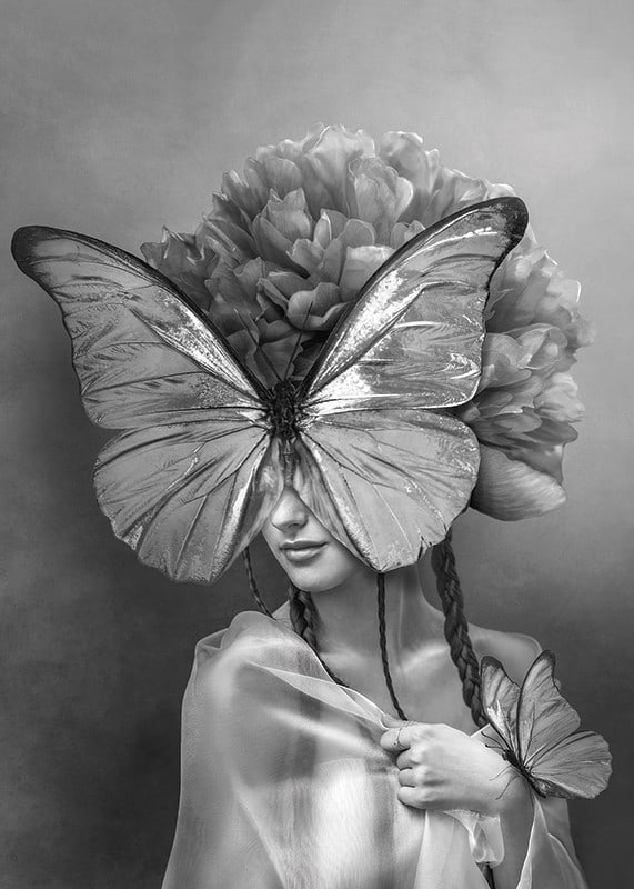Black and white portrait of woman with butterfly mask and peonies-12