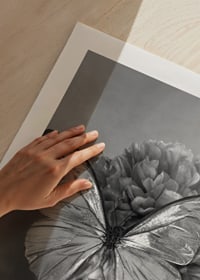 Black and white portrait of woman with butterfly mask and peonies-9