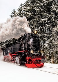 Steam locomotive trudging through snowy winter landscape, photography-7