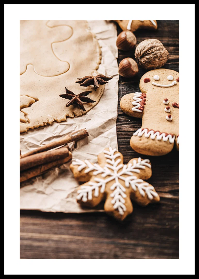 Close-up of gingerbread dough, star anise and decorated cookies-12