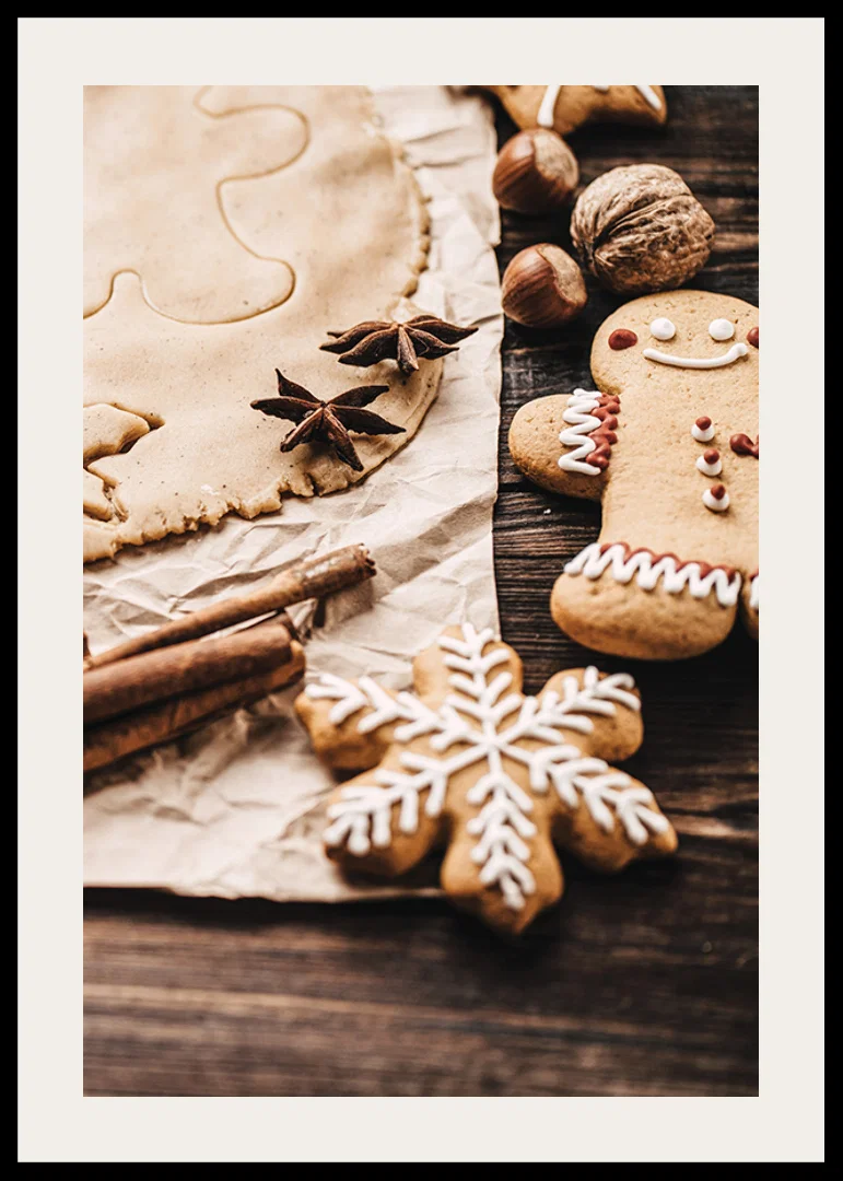 Close-up of gingerbread dough, star anise and decorated cookies-12