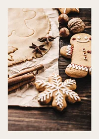 Close-up of gingerbread dough, star anise and decorated cookies-3
