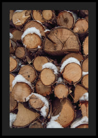 Close-up of stacked firewood with powdery snow, photographic-4