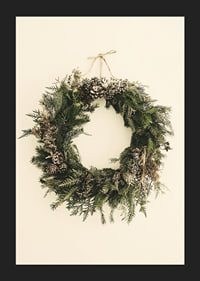 Photograph of green Christmas wreath with pine cones on beige background-5