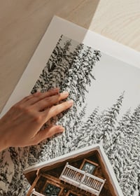 Wooden cottage surrounded by snow-covered fir trees in winter landscape-9