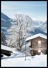 Photograph of wooden cabin in snow-covered mountain landscape and blue sky-6