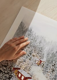 Illustrated train in a wintry landscape with snow-laden fir trees-9