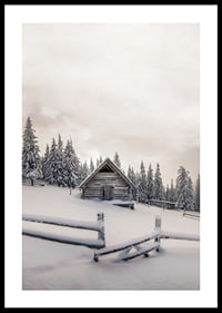 Photograph of wooden cottage in snow-covered landscape with fir trees-0