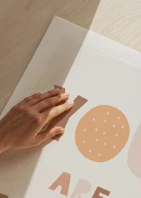 Illustrated letters in beige and brown on a light background-9