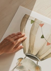 Watercolor illustration of elephant in hot air balloon with pastel flags-9
