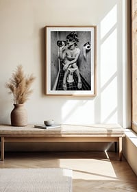 Black and white photo of woman with sunglasses in toilet-8